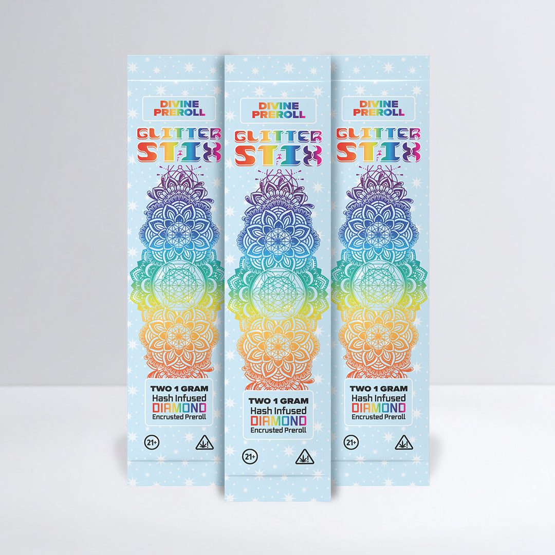Three packages of Divine Preroll Glitter Stix on a light gray background