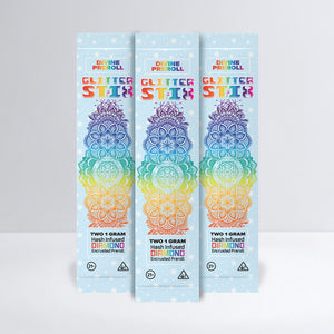 Three packages of Divine Preroll Glitter Stix on a light gray background
