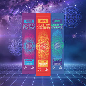 Three 'Holy Smokes' rolling paper packages with colorful designs on a futuristic grid and cosmic background.