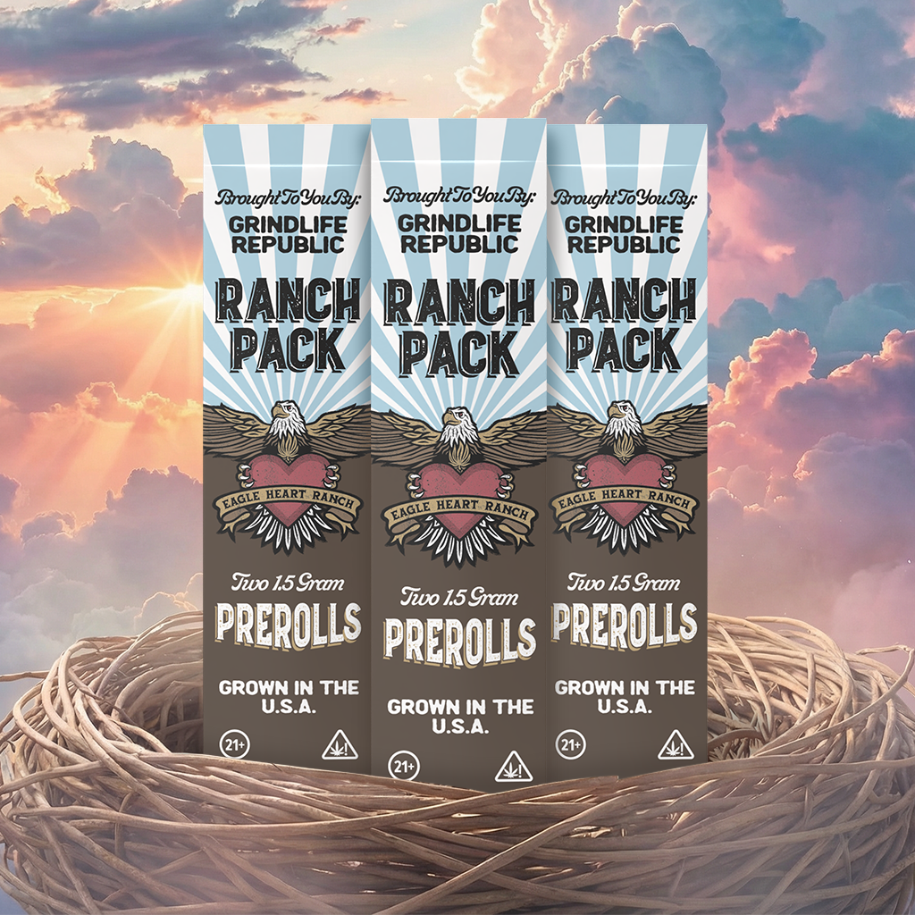 Three packages of Grindlife Republic Ranch Pack prerolls against a colorful sky background.