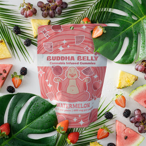 Buddha Belly cannabis-infused gummies packaging with tropical fruits and leaves on a white background
