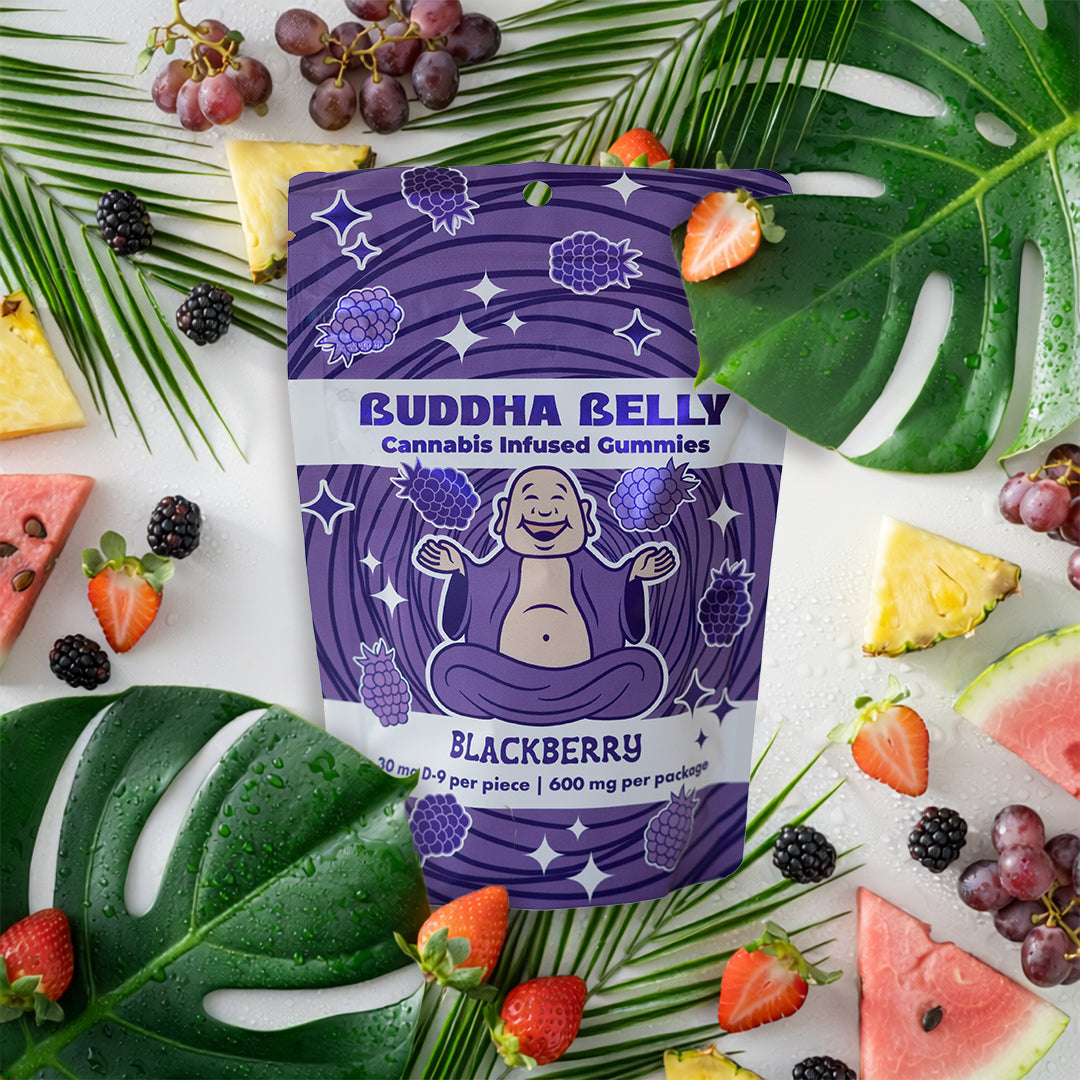 Buddha Belly cannabis-infused gummies packaging with blackberry flavor surrounded by fruits and leaves.
