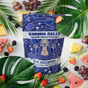 Buddha Belly cannabis-infused gummies package surrounded by fruits and leaves