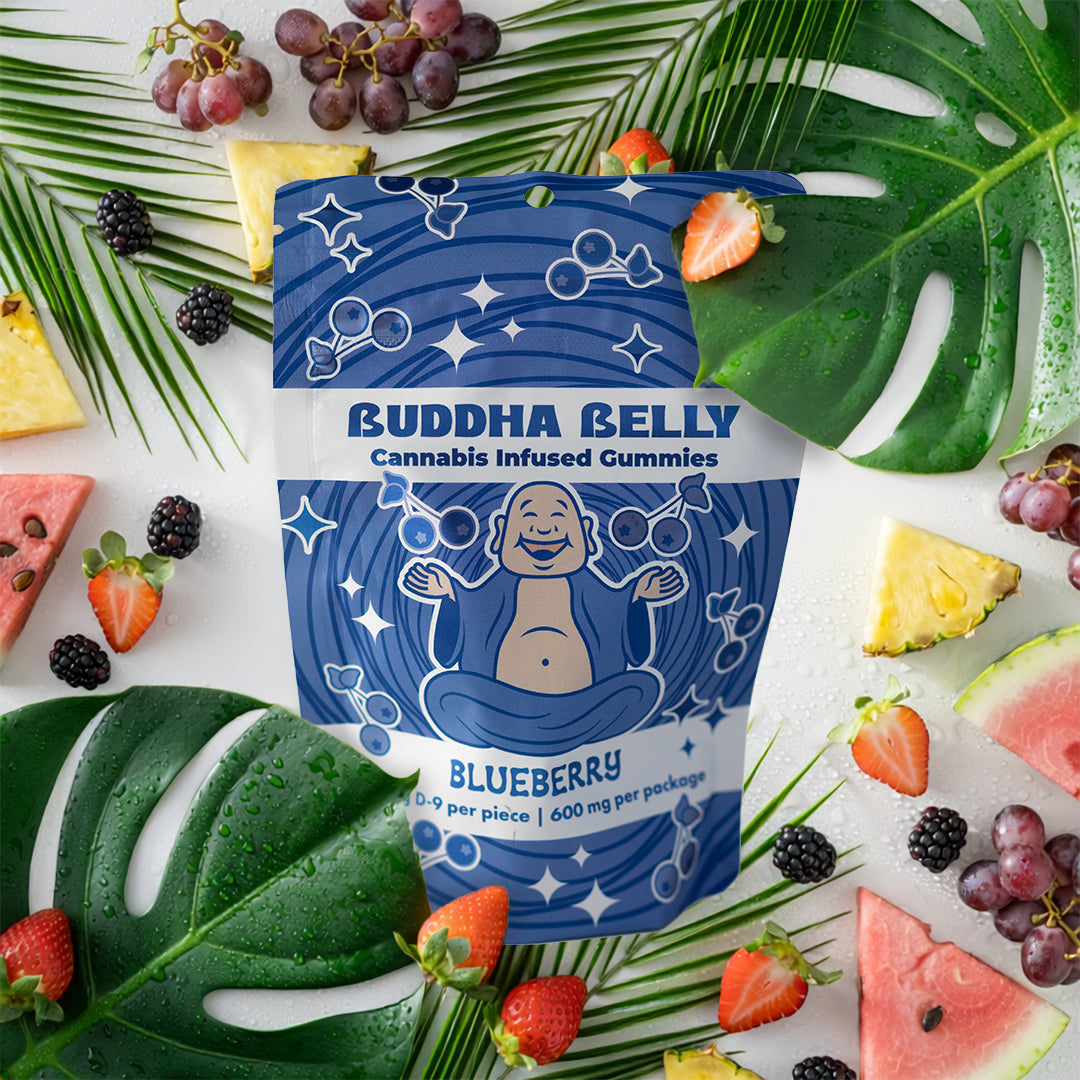 Buddha Belly cannabis-infused gummies packaging with blue design on a colorful background of fruits and leaves.