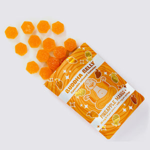 Orange packaging of Buddha Belly Pineapple mango cannabis-infused gummies on a white background
